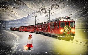 red christmas express in snowy landscape