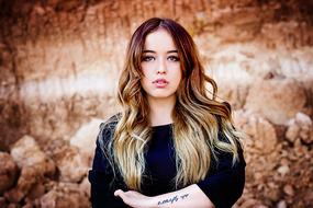 attractive girl with tattoo on the background of rocks in Mexico