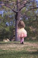Tree and girl pink dress