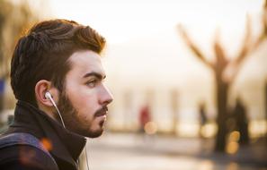 photo portrait of a man with a beard and headphones