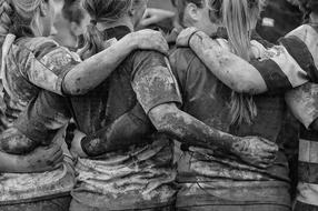 black and white photo of a female rugby team