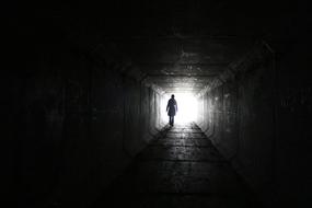 woman in mysterious tunnel
