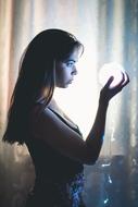 Gorgeous young girl with the light ball