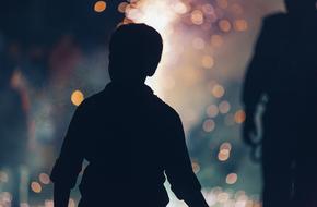 Silhouette of child Boy at bokeh background