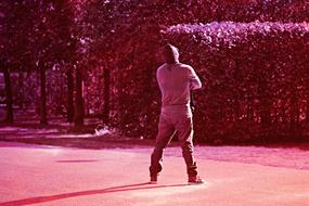 pink monochrome photo of a man who enjoys the sun