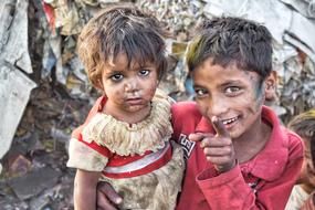 poor brother and sister in a slum in India