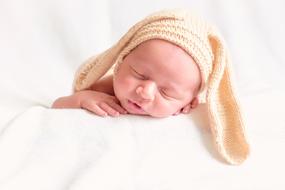baby in knitted hat with ears