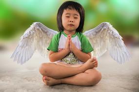 Little asian Girl with Angel wings praying, digital art