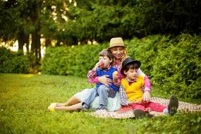 woman with sons in the park