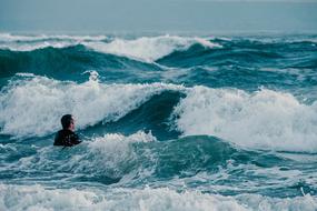 man swimming in the sea