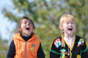 two happy child girls play outdoor