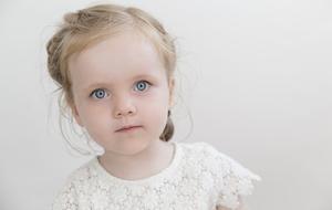 Portrait of the blonde girl with blue eyes