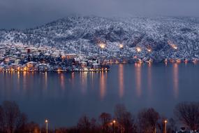 Lights of coastal city at winter evening