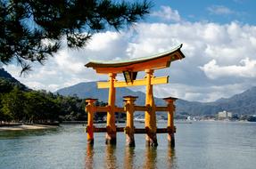 Beautiful O-Torii gate in the water in the Itsukushima Shrine in Miyajima, Japan, on the beautiful landscape