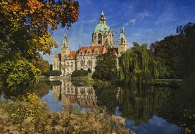 Beautiful, vintage palace among the colorful trees on the shore