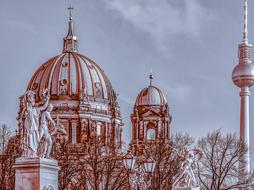 Beautiful and colorful drawing of the Berlin Cathedral in Germany, among the trees, under the sky with clouds