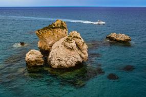 Jet ski near the beautiful Aphrodite's Rock, on Cyprus, Greece