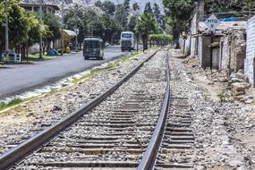 traffic on asphalt road beside of railway, Peru, San Jeronimo De Surco