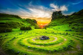 sunset over an island in scotland