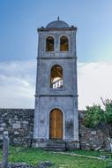 Tower Ancient near a stone fence