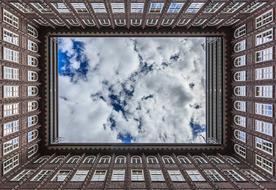 Low angle shot of the beautiful Chile House, under the blue sky with white clouds, in Hamburg, Germany