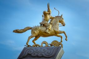 gilded statue of a man on horse