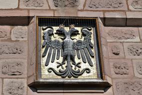 coat of arms on the facade of the building in Nuremberg
