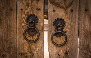 Beautiful, traditional, wooden gate with metal knockers of the Hanok, in Republic of Korea