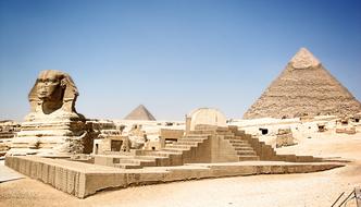 Egyptian pyramids and sphinxes in the desert