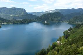scenic landscape, Pilgrimage Church of the Assumption of Maria on small island on lake Bled at summer, Slovenia