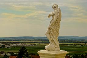 sculpture of an angel on a pedestal