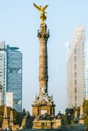 Mexico City statue among the buildings