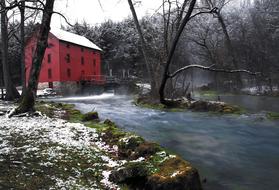 Gristmill Building among the plants near the water