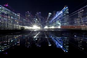 Beautiful cityscape of a city, with colorful lights, with the reflection, at night