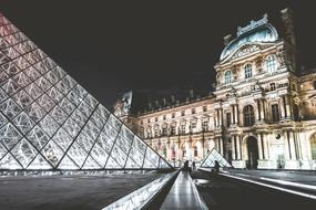 illuminated entrance to Louvre Museum at night, france, Paris