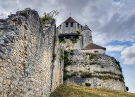 12th-century watchtower, caesar tower at cloudy sky in france in provins