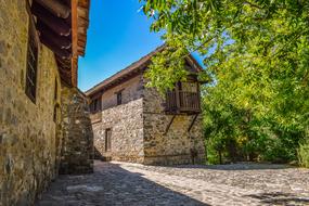 Beautiful monastery, among the colorful trees in Kalopanayiotis, Cyprus, Greece, at blue sky on background