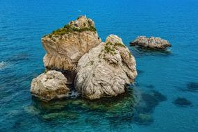 Beautiful Aphrodite's Rock with green plants, on Cyprus, Greece