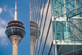 Rheinturm and glass skyscraper in Dusseldorf