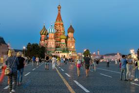 tourists on red square in moscow at dusk