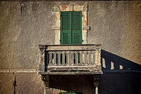 House Facade with old green window
