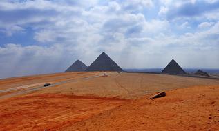 photo of red sand and the famous pyramids in Egypt