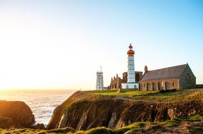 Saint-Mathieu lighthouse and ruins of abbey on rock at sea, france, Plougonvelin