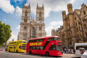 red and Yellow double-decker buses in historical center of city, uk, england, london