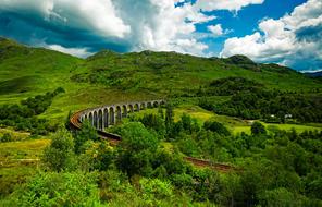 panoramic view of the viaduct among the green trees in scotland