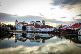 mirror reflection of houses in a pond in the Czech Republic