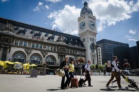 tourists on the square of the old town in france on a sunny day