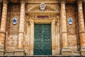 green front door to cathedral in sicily