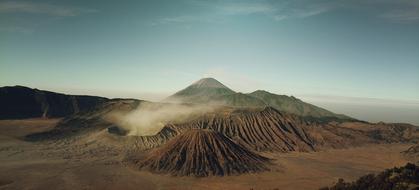 Beautiful and colorful landscape with the volcanoes in Island, under the sky with clouds