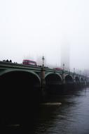 view from the water on the architecture of the bridge in London